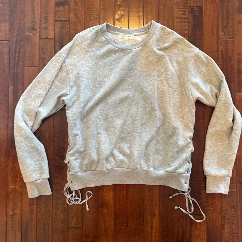 Gently worn, comfy grey crew neck sweatshirt with ties on the side